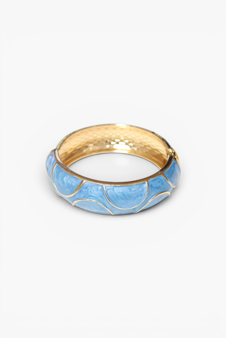 Gold and blue bangle on a white background