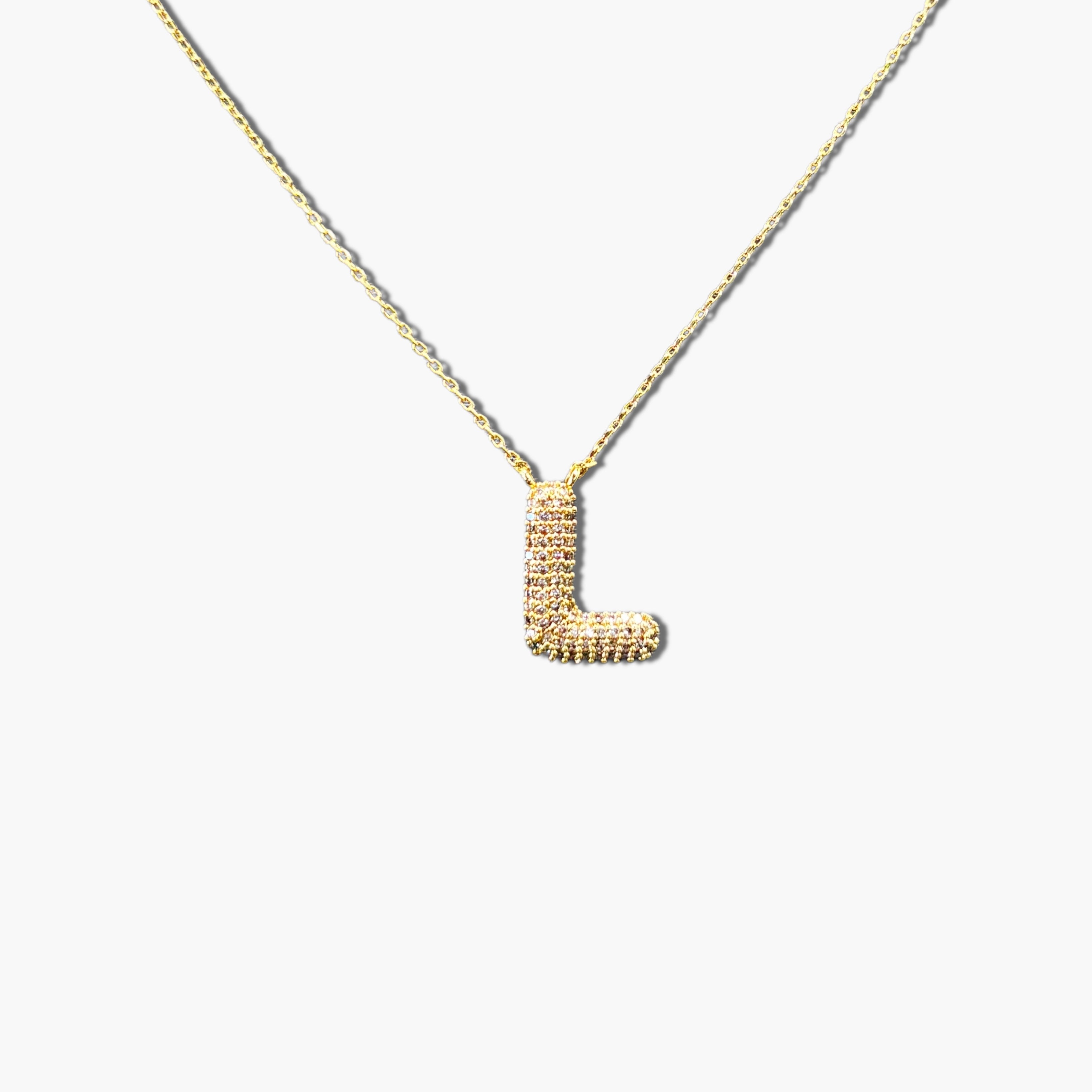 A gold-plated letter necklace with a pleated design on the pendant.