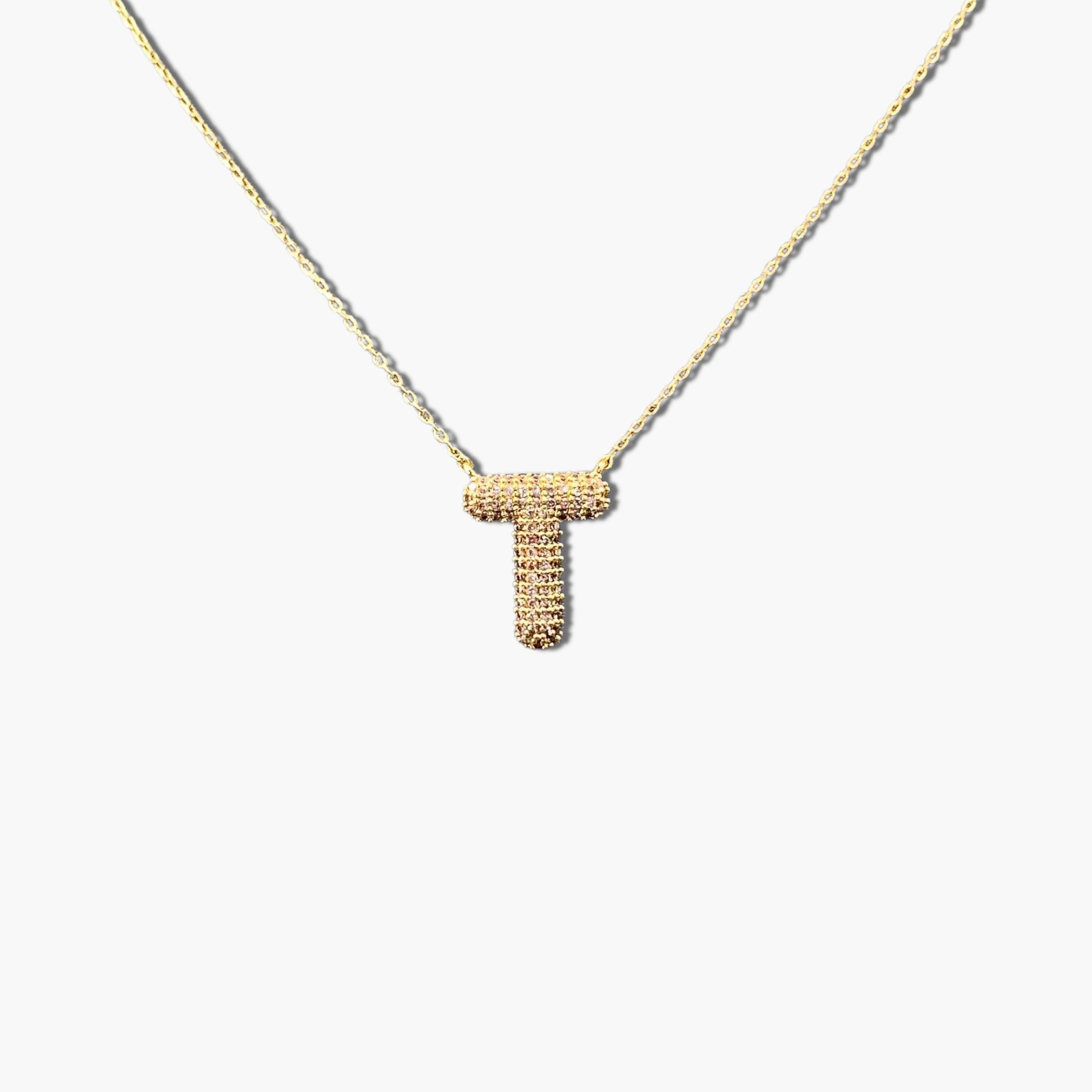 A gold-plated letter necklace with a pleated design on the pendant.