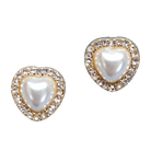 Heart-shaped earrings with pearl centers and gold accents on a white background