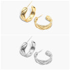 A pair of gold-colored hoop earrings with a textured surface, displayed against a white background. The earrings have a bohemian style with an open hoop design.