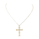 Gold cross necklace with diamonds on a white background