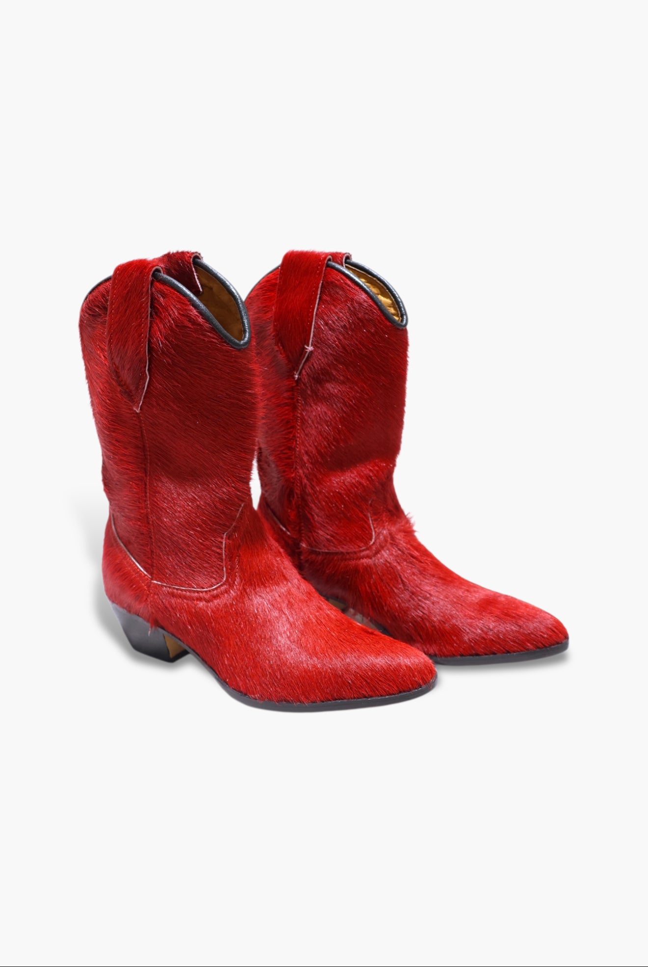 Pair of red cowboy boots on a white background