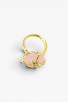 Faceted natural stone statement ring with crystal accents in a gold-tone setting featuring an elegant gemstone centerpiece.