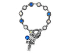 Bracelet with blue gemstones and a cross charm on a white background
