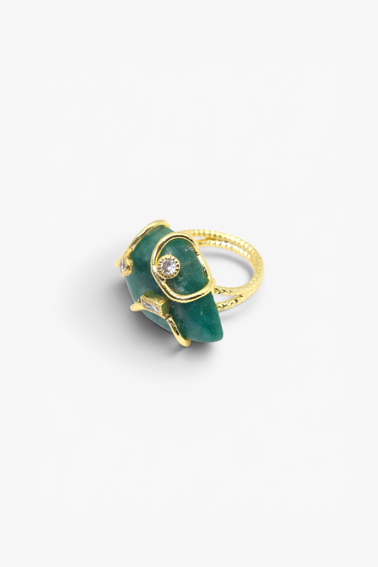Natural stone statement ring with crystal accents in a gold-tone setting featuring an organic gemstone centerpiece.