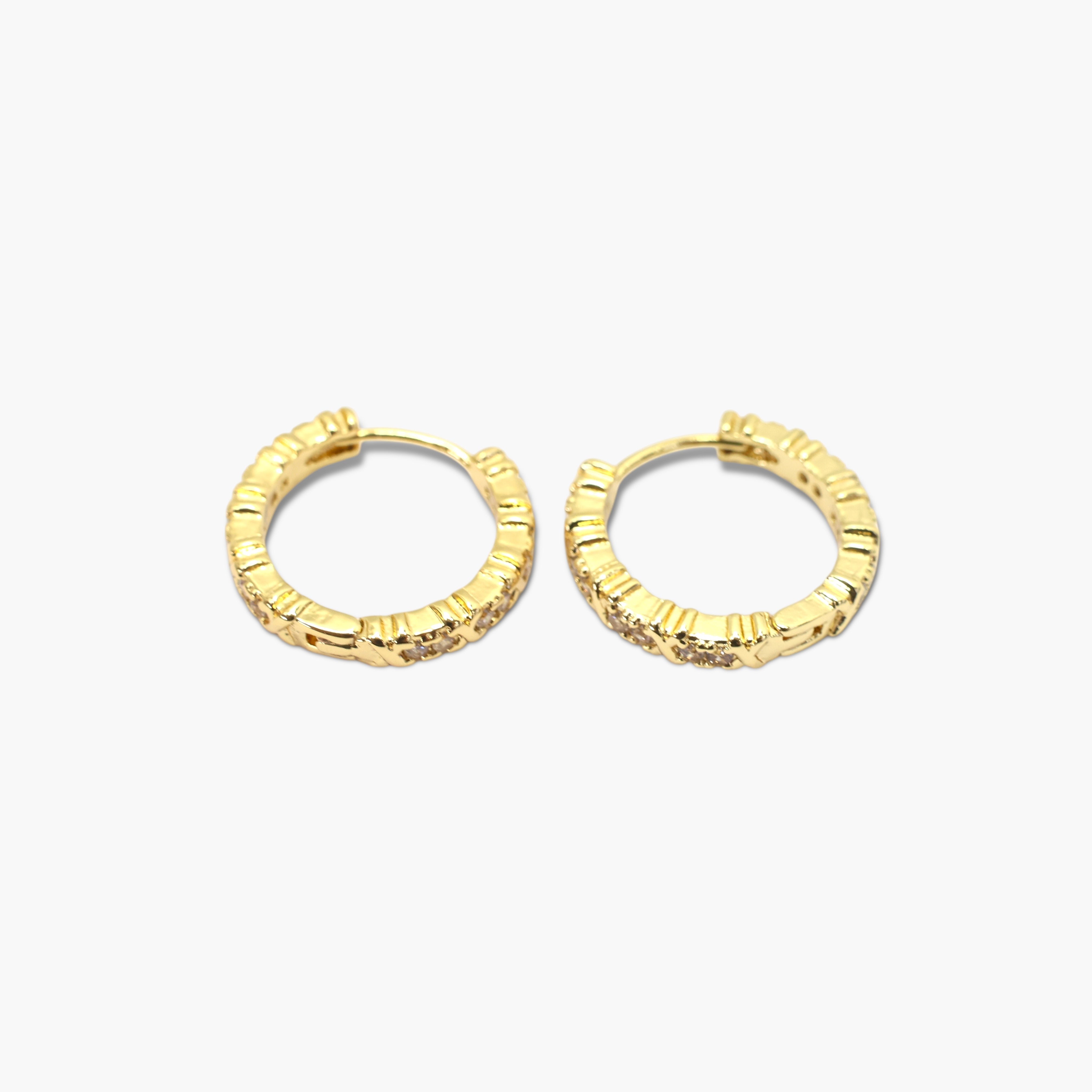 A pair of gold-colored hoop earrings with a textured surface on a white background.