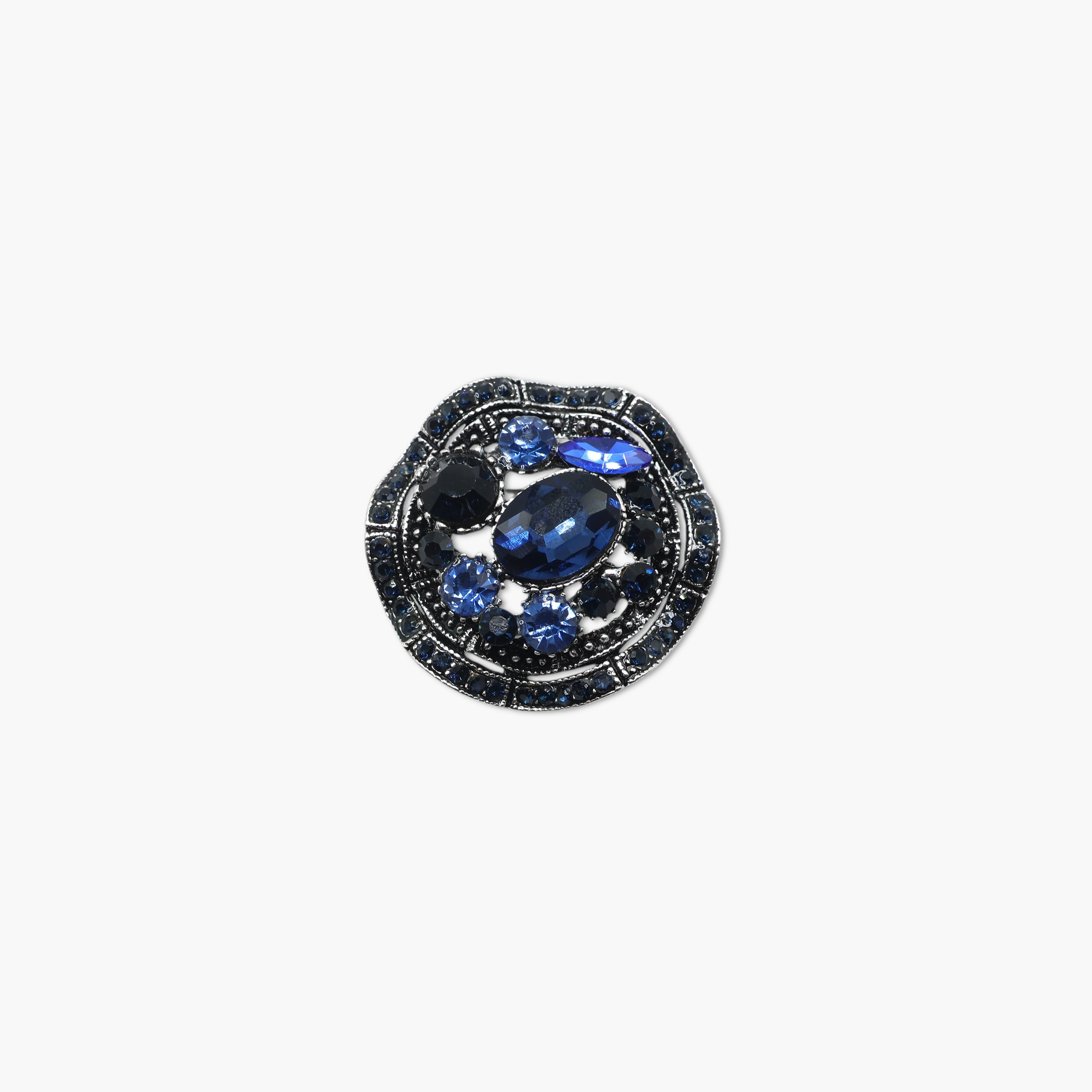 Jewelry item with blue gemstone and black metal setting on a white background