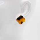 A collection of vintage style earrings with various patterns including floral, geometric, and animal prints.