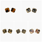 A collection of vintage style earrings with various patterns including floral, geometric, and animal prints.