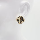 A collection of vintage style earrings with various patterns including floral, geometric, and animal prints.