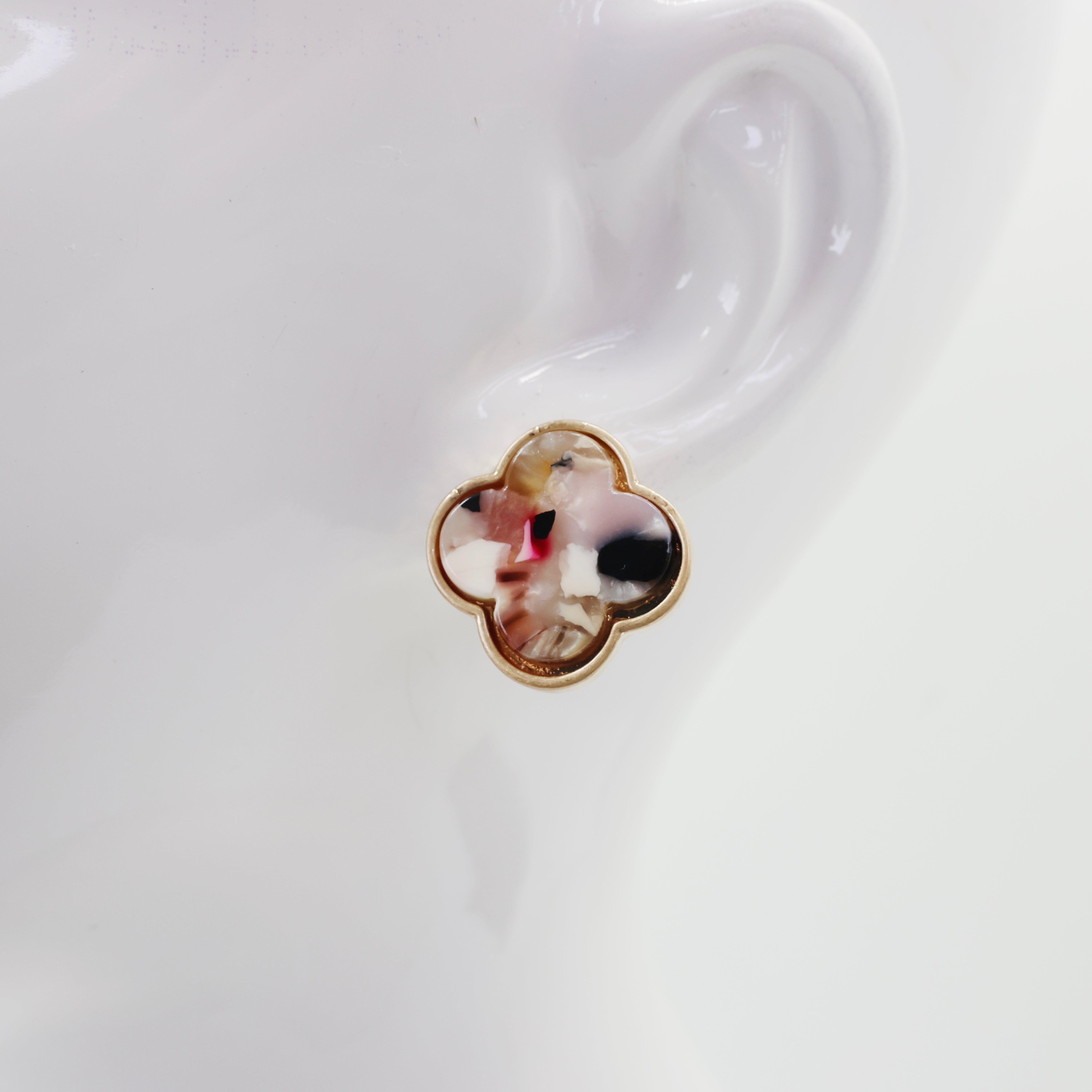 A collection of vintage style earrings with various patterns including floral, geometric, and animal prints.