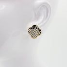 A collection of vintage style earrings with various patterns including floral, geometric, and animal prints.