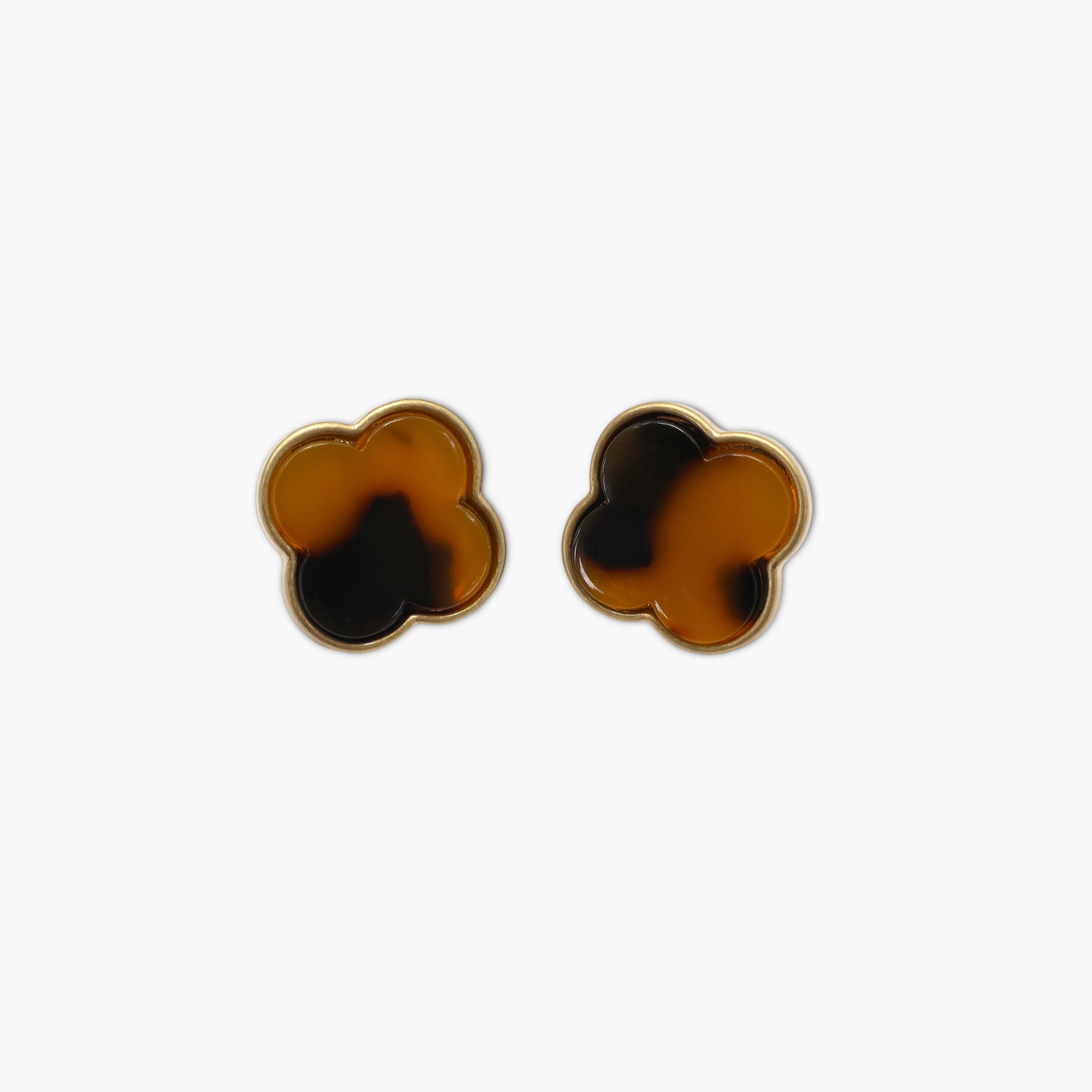 A pair of vintage-style animal post earrings with a brown and black color scheme.