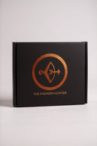 Black box with 'The Fashion Hunter' logo on a white background