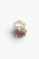 Raw natural stone statement ring with gold-tone band and organic handcrafted design.